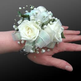 White rose wrist corsage with baby's breath and silver ribbon