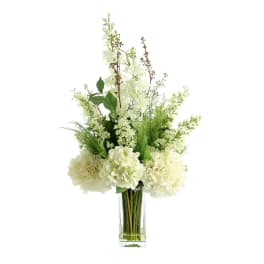 White floral arrangement in a clear glass vase