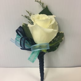 White rose boutonniere with blue ribbon accents