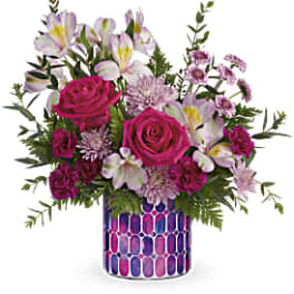 Pink roses and white alstroemeria in a patterned vase