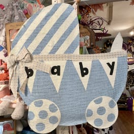 Blue and white fabric baby carriage wall hanging with the word baby