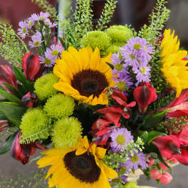 Bouquet with sunflowers, purple daisies, red alstroemeria, and green chrysanthemums