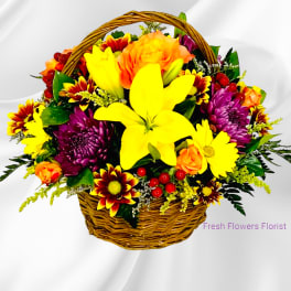 Basket of yellow, orange, and purple flowers