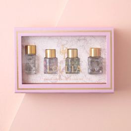 Pink gift box with four small perfume bottles inside