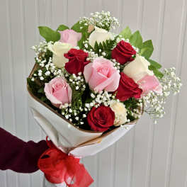 Bouquet of red, pink, and white roses with baby's breath