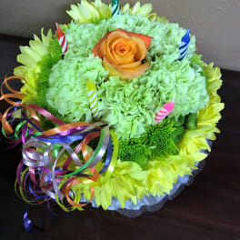 Round bouquet of green carnations and yellow daisies with an orange rose
