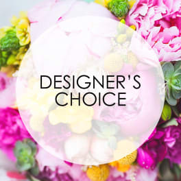 Designer’s choice floral arrangement with pink and yellow blooms