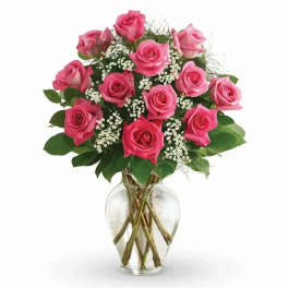 Pink roses arranged in a clear glass vase