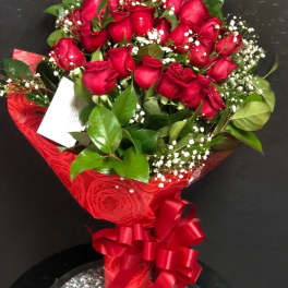 Bouquet of red roses with baby's breath and a red ribbon wrap
