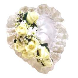 Cream rose bouquet with white filler flowers and a ruffled wrap