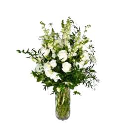 White floral arrangement in a clear glass vase