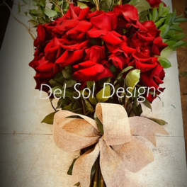 Bouquet of red roses with a beige ribbon wrap