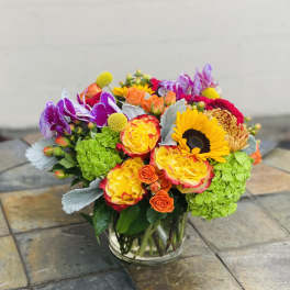 Colorful mixed bouquet in a clear glass vase