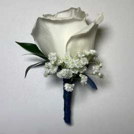 White calla lily boutonniere with baby's breath and dark ribbon