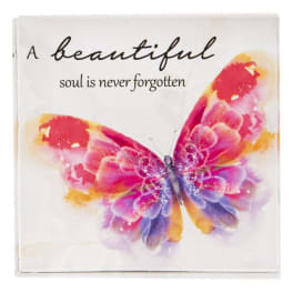 Decorative plaque with a colorful butterfly and memorial text