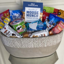 Gift basket filled with assorted snacks and chocolates