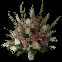 Pink and white floral arrangement in a white vase
