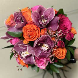 Bouquet of purple orchids and orange and pink roses