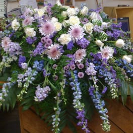 Large casket spray with white and lavender flowers