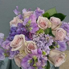 Bouquet of pale pink roses and lavender flowers