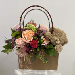 Flower gift bag with plush bear by Westford Florist Art by Veny