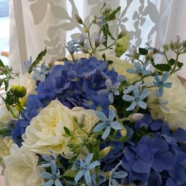 Blue and white flower bouquet in a vase