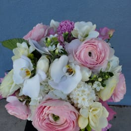 Pink and white mixed bouquet with orchids and ranunculus