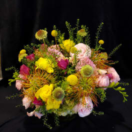 Colorful mixed bouquet with pink, yellow, and orange flowers