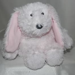 White plush bunny with pink ears and black eyes