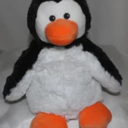 Plush penguin toy with orange beak and feet