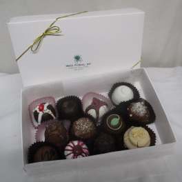 Box of assorted chocolate truffles in paper cups