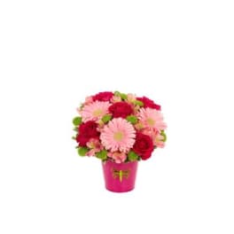 Pink and red flower bouquet in a bright pink vase