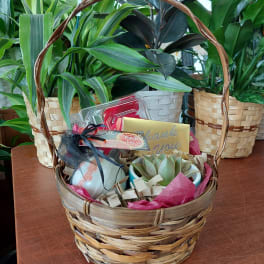 Gift basket with a succulent, bath items, and a thank-you card