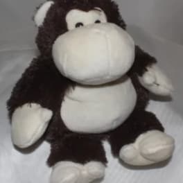 Plush monkey toy with a white face and belly