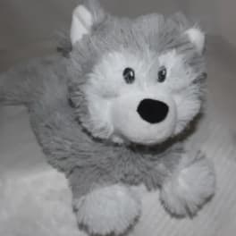 Gray and white plush husky toy with black eyes and nose