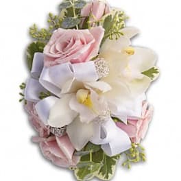 Bouquet of pink roses and white orchids with a lavender ribbon