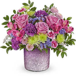 Pink and purple mixed bouquet in a glittery lavender vase