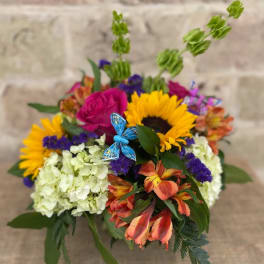 Colorful bouquet with sunflowers, roses, hydrangeas, and orange lilies