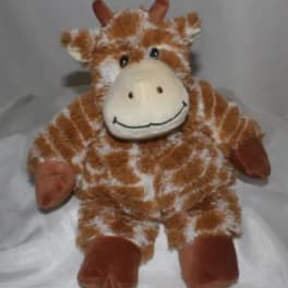 Plush giraffe toy with a smiling face and brown-and-white spotted fur