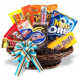 Basket of assorted candy bars with a striped ribbon bow