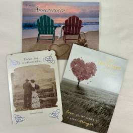 Three anniversary greeting cards with beach and heart designs