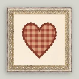 Framed plaid heart artwork on a cream background