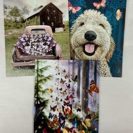 Three decorative cards with a dog, butterflies, and a flower-covered truck