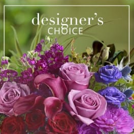 Mixed bouquet of roses, calla lilies, and purple flowers