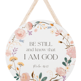 Round floral wall sign with Bible verse and hanging ribbon