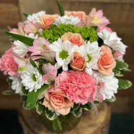 Bouquet of pink roses, carnations, and white daisies