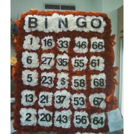 Floral bingo board with white flower squares and black numbers on an orange-red background