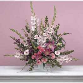 Pink and white floral arrangement in a white vase