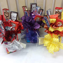 Candy gift bouquets with chocolate bars and large ribbon bows