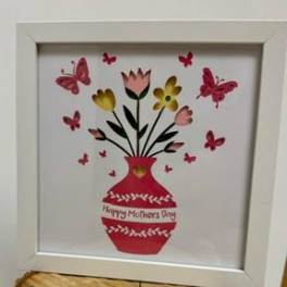 Framed Mother’s Day floral print with a red vase and butterflies